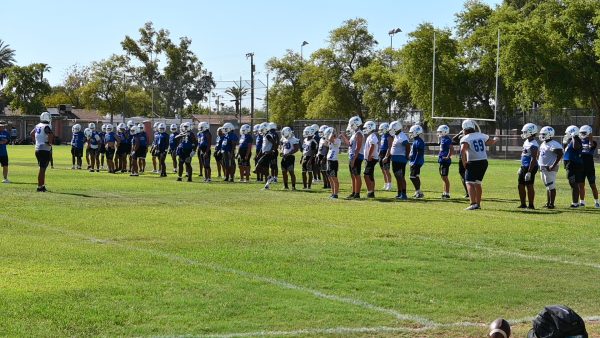 Chandler Varsity Football team lines up for drills in preparation for an upcoming game.