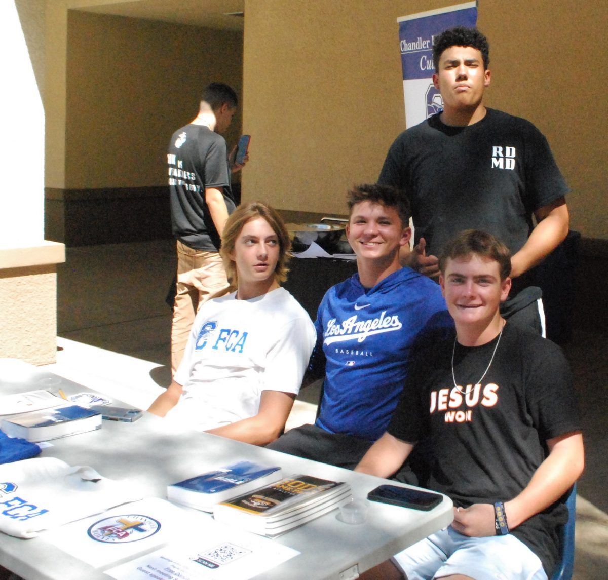 Left to Right: Jackson Brack, Yale Johnson, Devan Wilson, DJ vandervalk working the FCA club fair table 