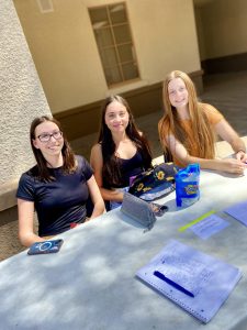  Sofia Coria, Logan Chavez, and Aurora Lambson represent the CHS Hiking Club at Club Fair on Wednesday, August 14. 2024.