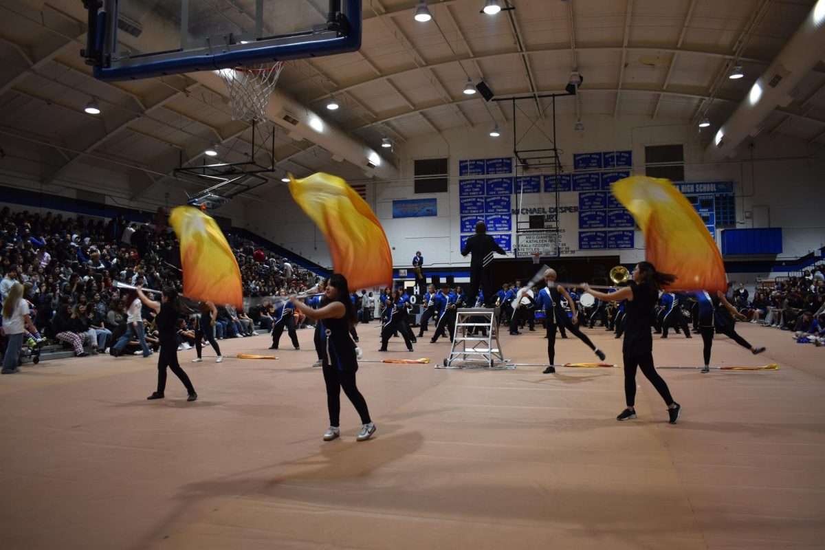 Color Guard showing off their skills at the 2024 Winter Assembly