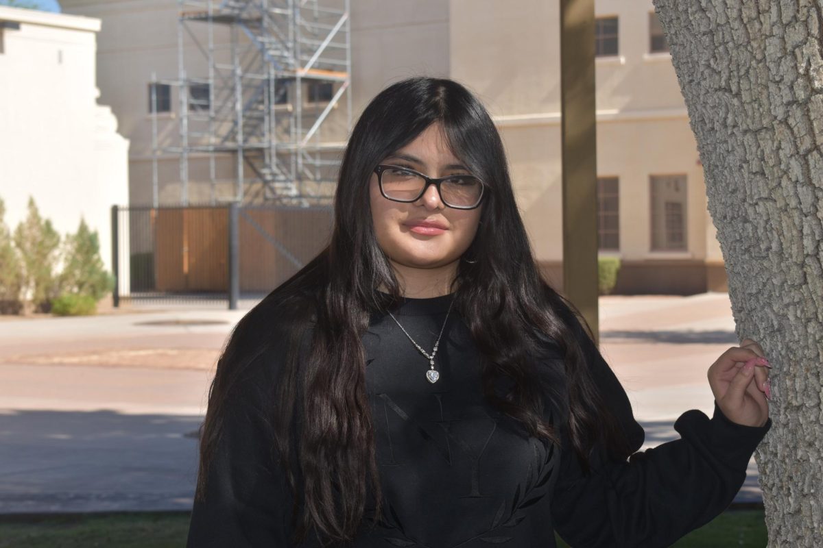 On July 24, 2025, Dhalia Flores was one of many reporters to be photographed outside the Chandler Center for the Arts.