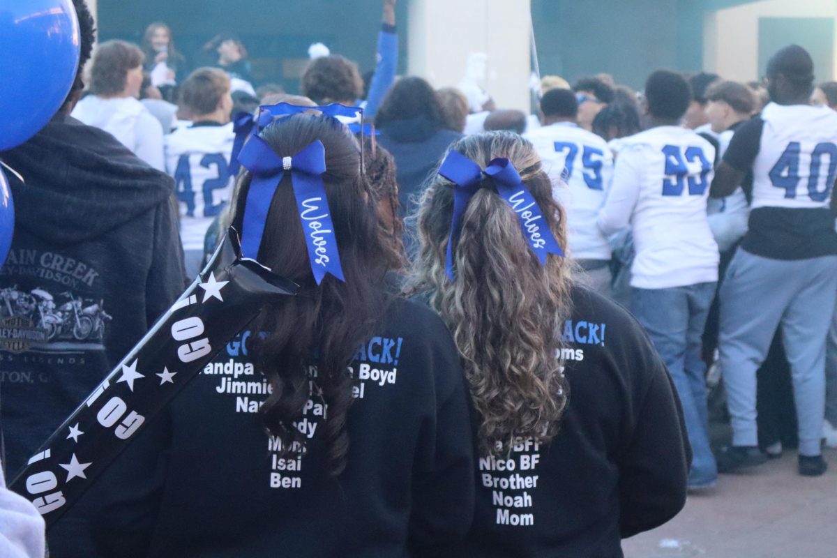 The Chandler High School cheerleaders watch Mr. Milbrandt deliver an inspiring speech before the football state championship against Basha High School on December 5, 2025.