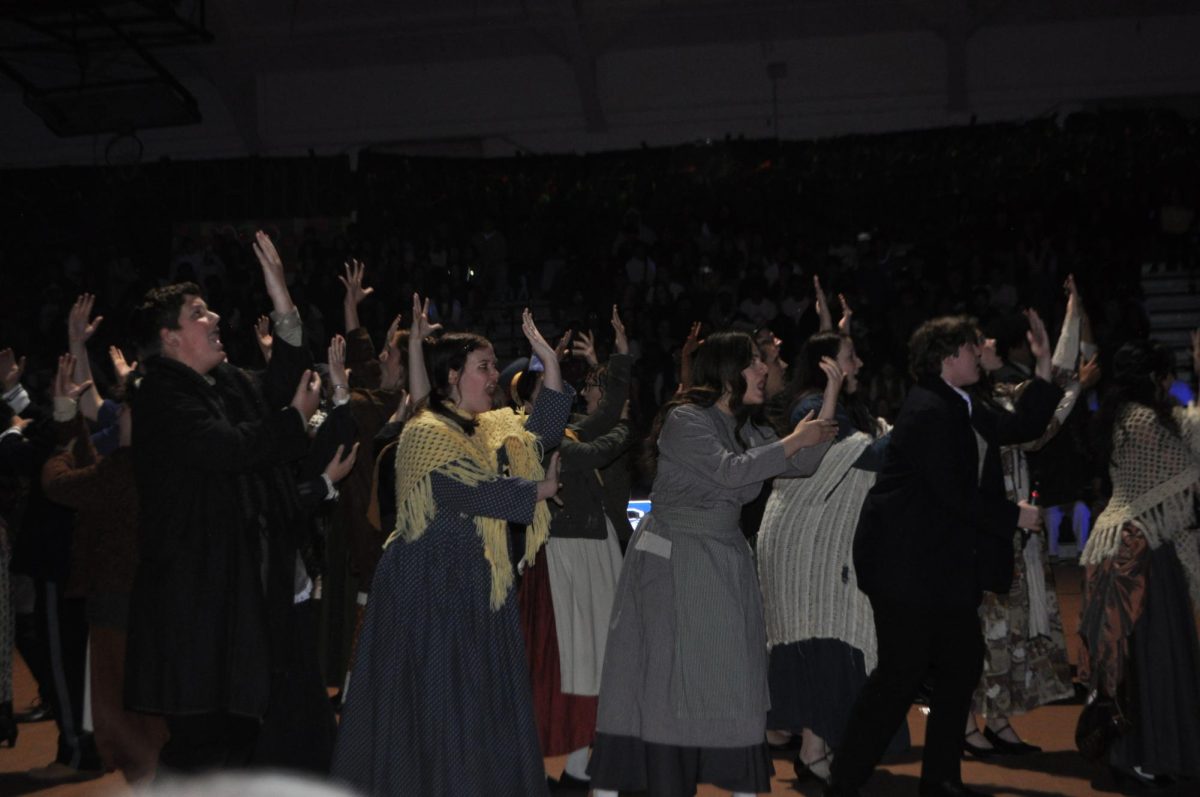 Theater performing a scene at the spring assembly from their play called Sweeney Todd.