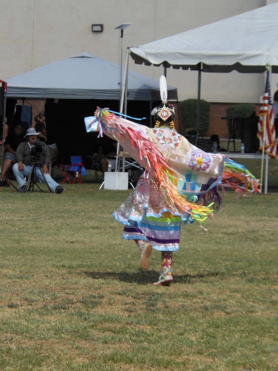 A Fancy Shawl Dancer on April 11, 2026, foots work matched the rhythm of the drum at the first CUSD Powwow.
